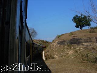 Snow capped mountains in front of the train