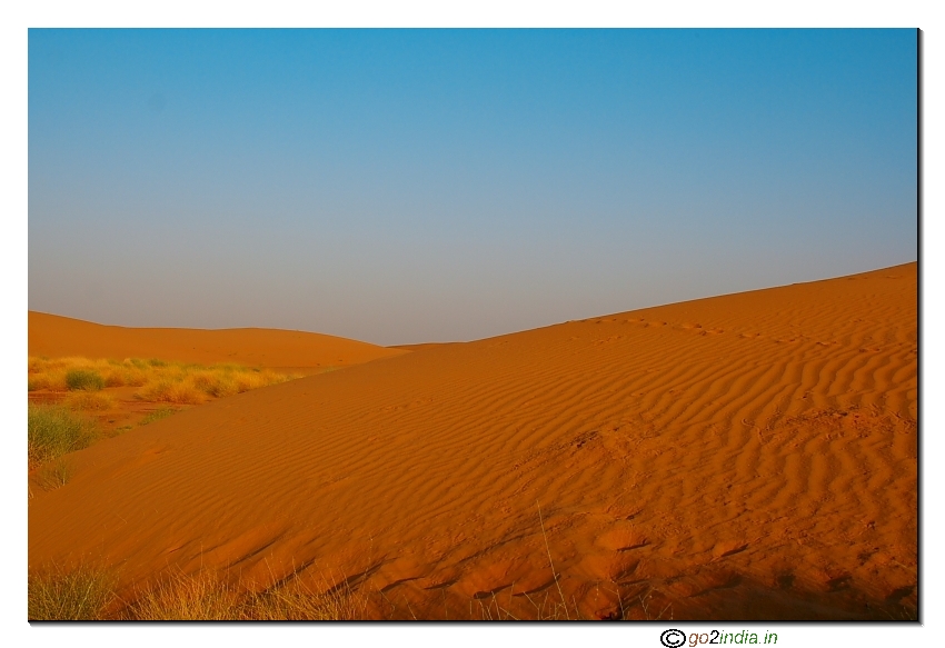 Color of Sand dunes under fading sunlight