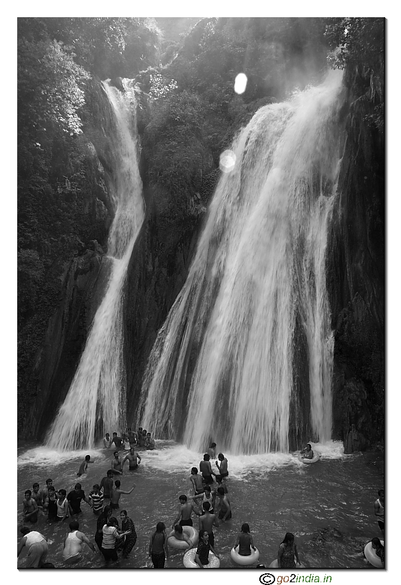 Tourist enjoying water below Kempty waterfall 