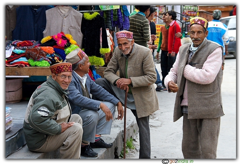 Group of old age people chit chatting in a street at Manali, Himachal Pradesh