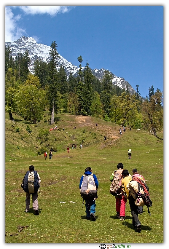 People carrying paragliding material to hill peak at Solang valley of Manali