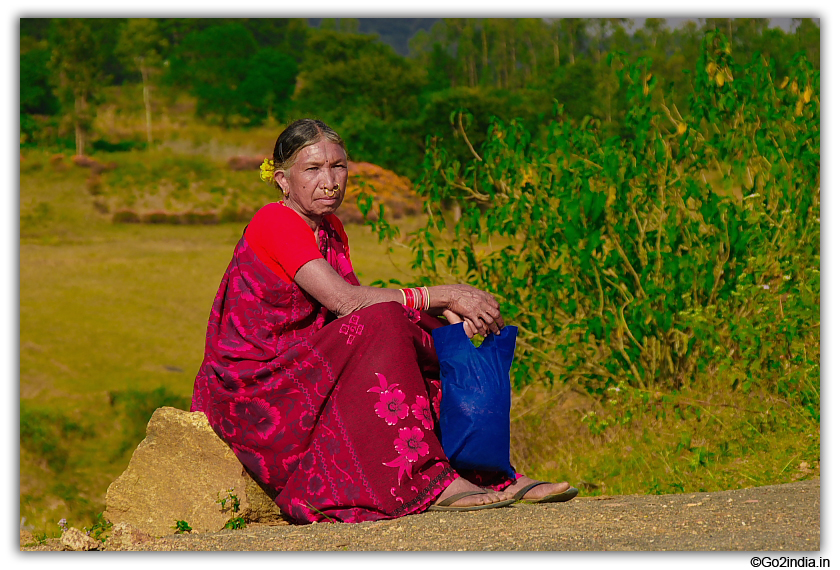 Tribal lady waiting by the road side at Paderu