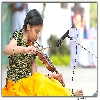 Girl playing Violin in a function