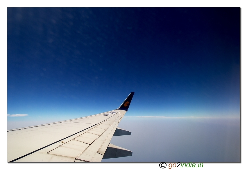 Wing of the flight and blue sky on the way to Andaman island