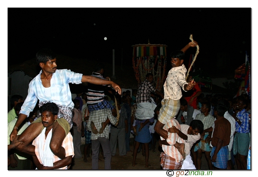 Hitting the hands of a person with rope during the festival