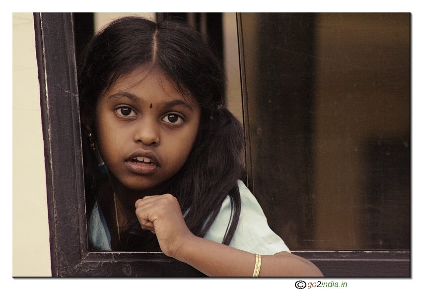 Girl looking out of window