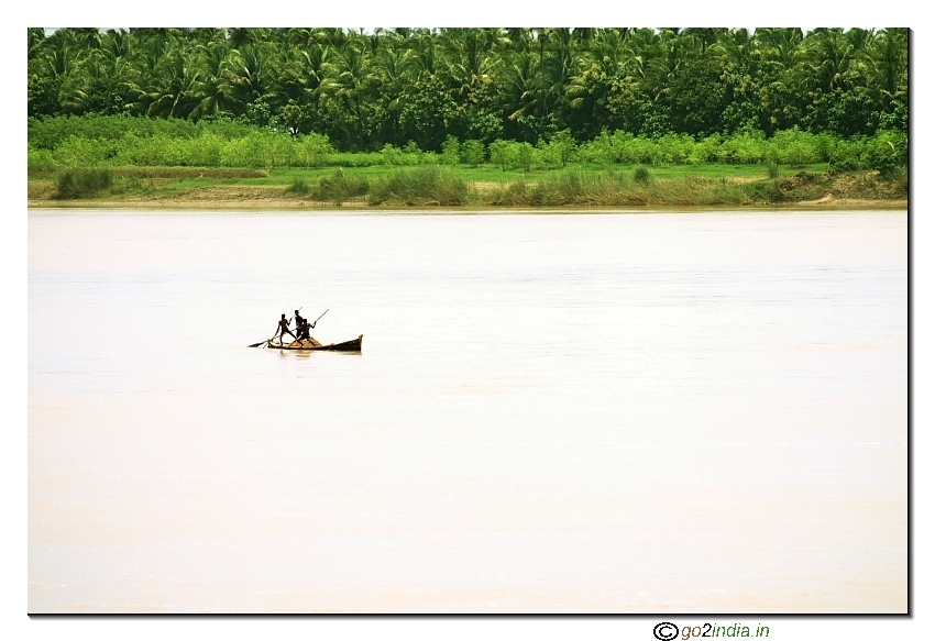 Three kids taking out sand from river Godavari of Andhrapradesh