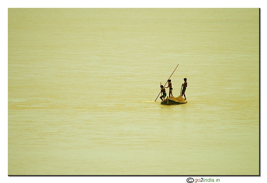 Kids collecting  sand from river Godavari for selling  Andhrapradesh India