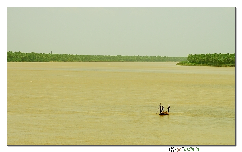 Wide view of river Godavari with kids in the scene