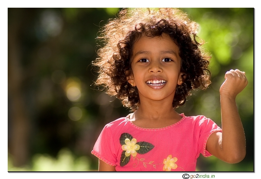 Little girl with rising hands