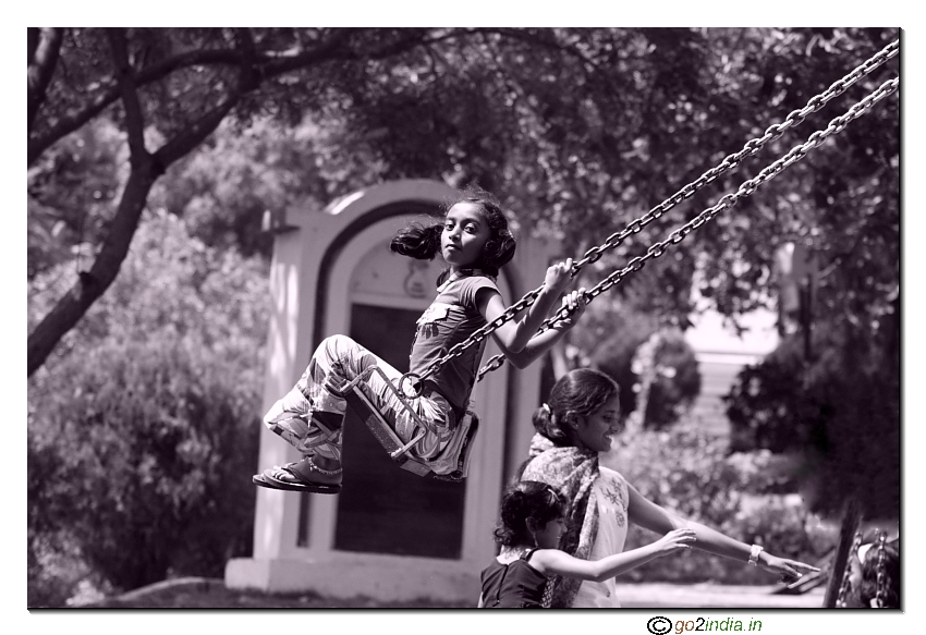 Girl playing in a hanging