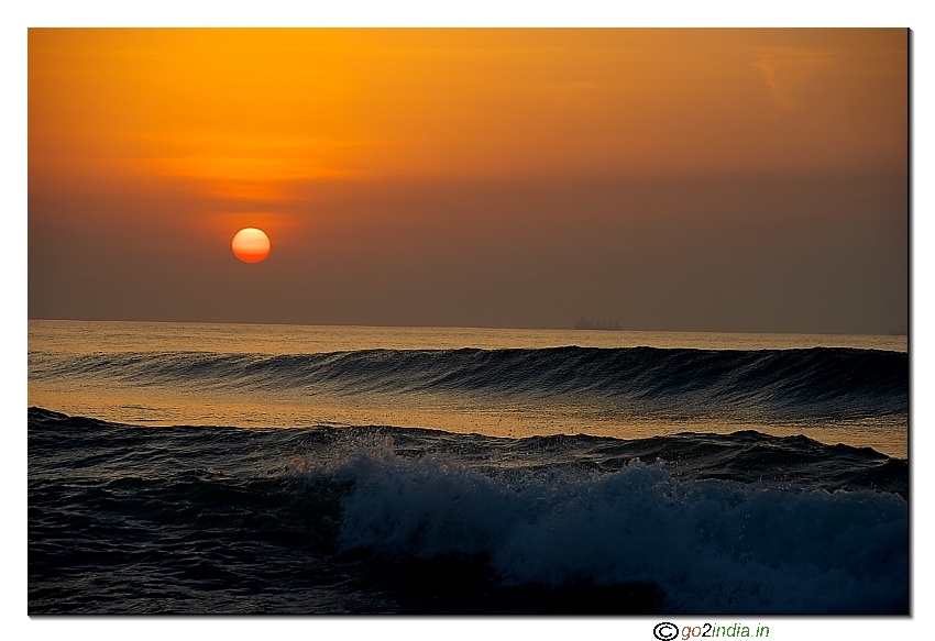 Sun rise at Yarada beach along with sea waves, in Visakhapatnam