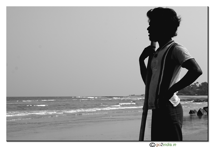 A boy watching the sea at Rishikonda beach Visakhapatnam, Andhra pradesh