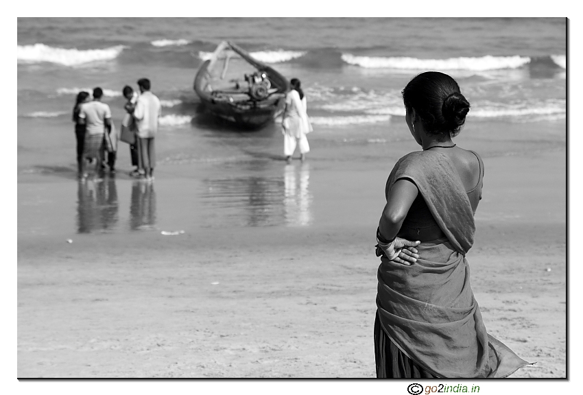 Girl looking at peole playing in sea, Rishi konda beach vizag
