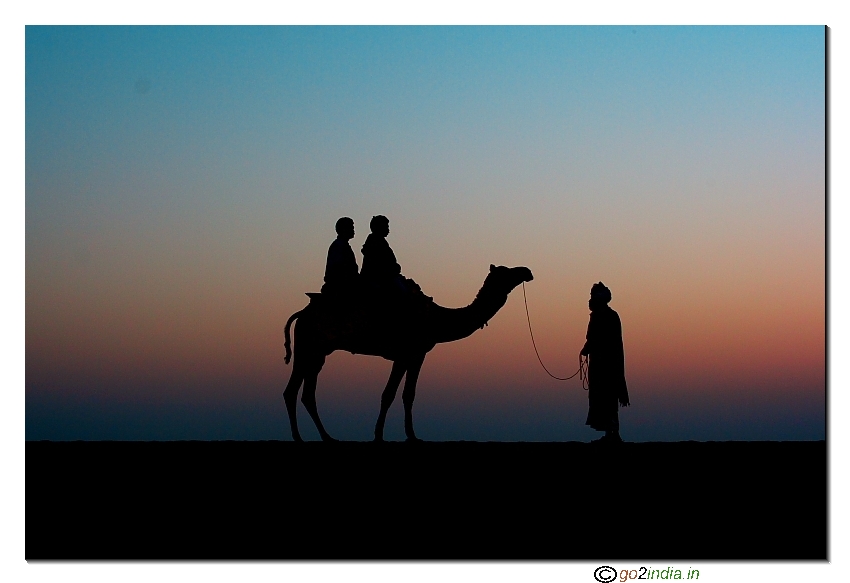 Man and camel during Sunset time at Sam Sand dunes