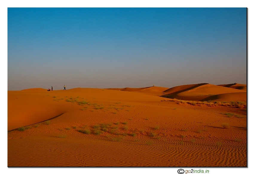 Red color of sand dunes during sunset time