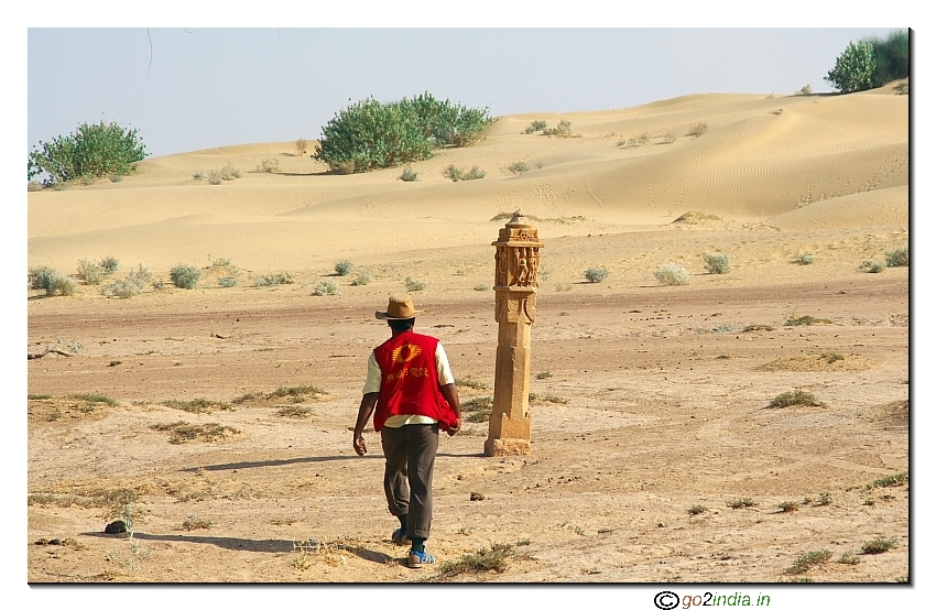 person walking alone in the desert