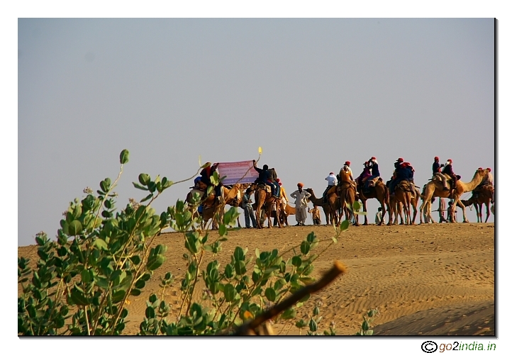 Camel and tourist inside desert