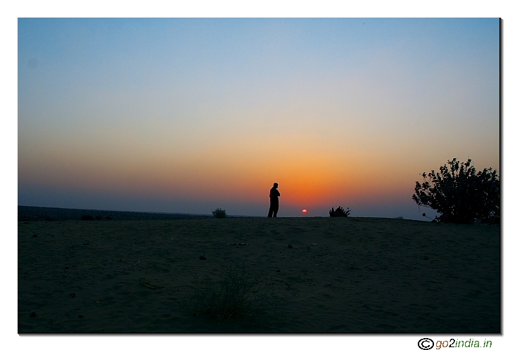 Watching sunset inside desert
