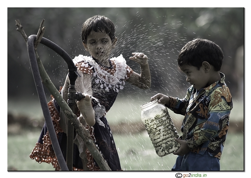 kids playing with tap water dirty box candid moments