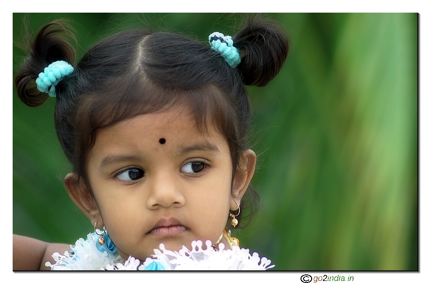 Blue dressed girl child portrait from Canon 85/1.8 lens on 20D