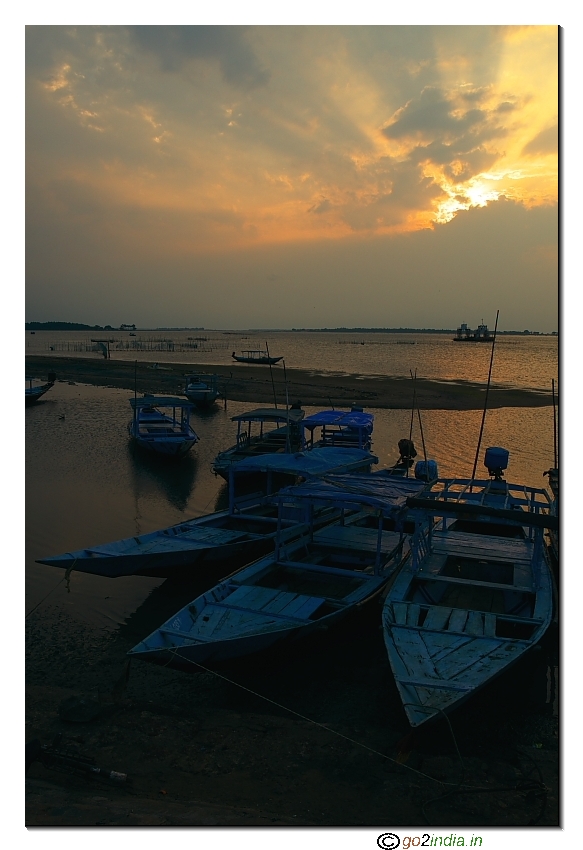 Sunset view at Chilika lake at Satapada with motor boats