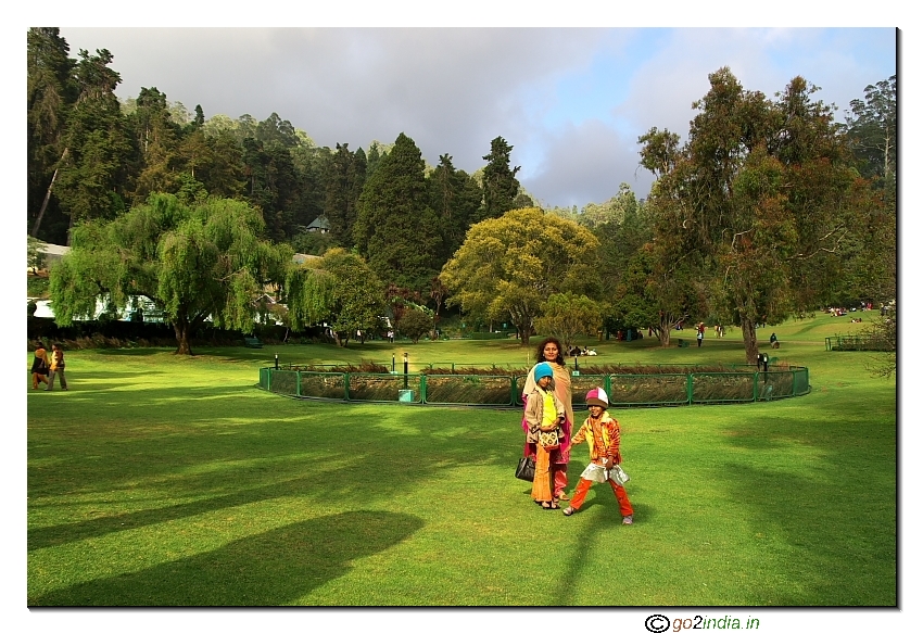 Family with kids enjoying at Botanical garden Ooty picnic spot