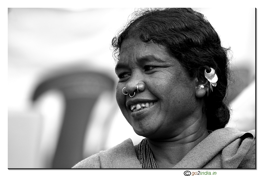 tribal lady smiling in Orissa fair on Adivasi grounds