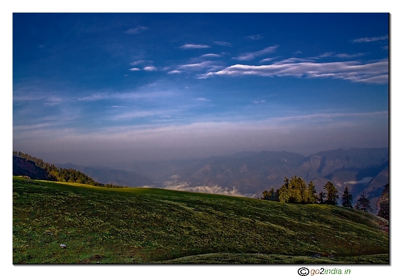 Blue sky and green valley near Kedar Kantha trekking camp