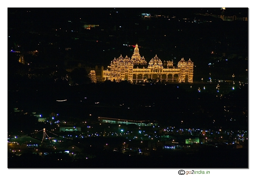 illuminated main palace of Mysore as seen from Chamundi hill