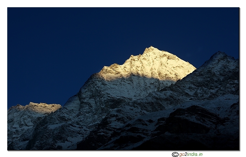 Morning sun light falling on the snow peaks at Badrinath