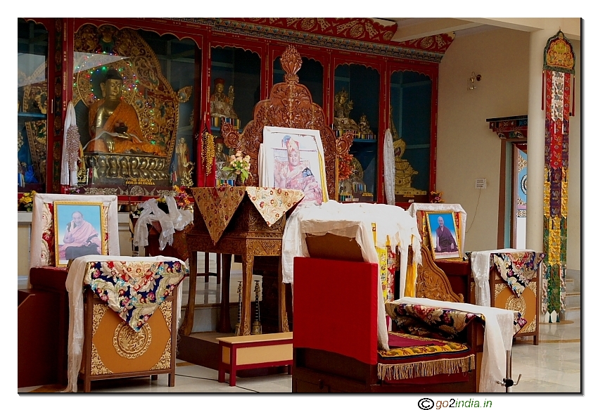 Photographs and statues inside Monastery at Manali 