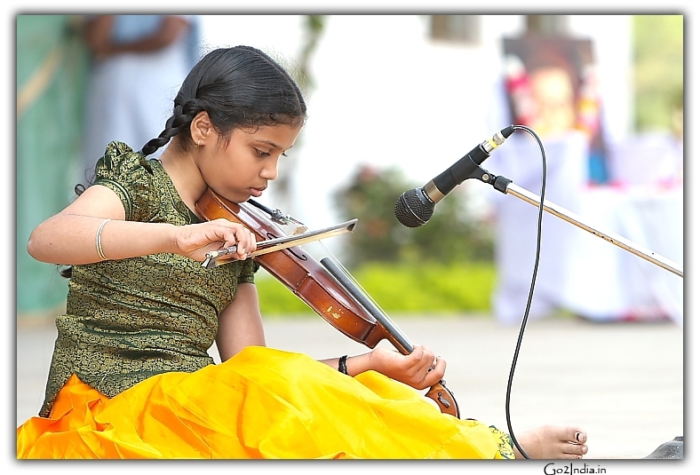 Girl playing Violin in a function
