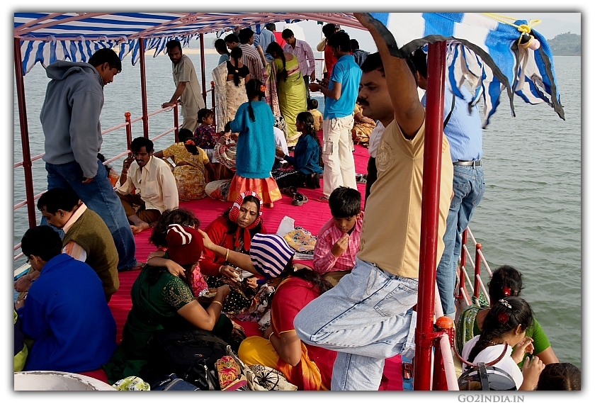 Godavari cruise service people taking breakfast on top of the launch