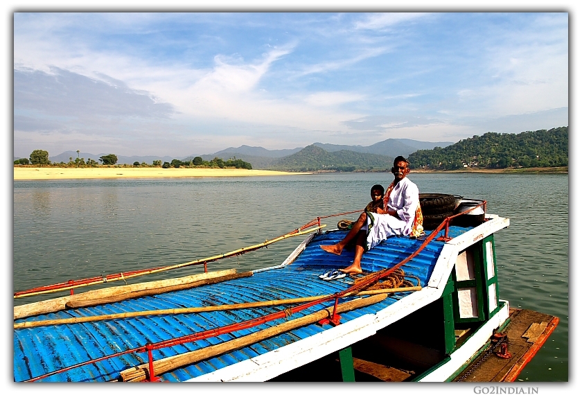 person sitting on the launch travelling in river Godavari papi hills area