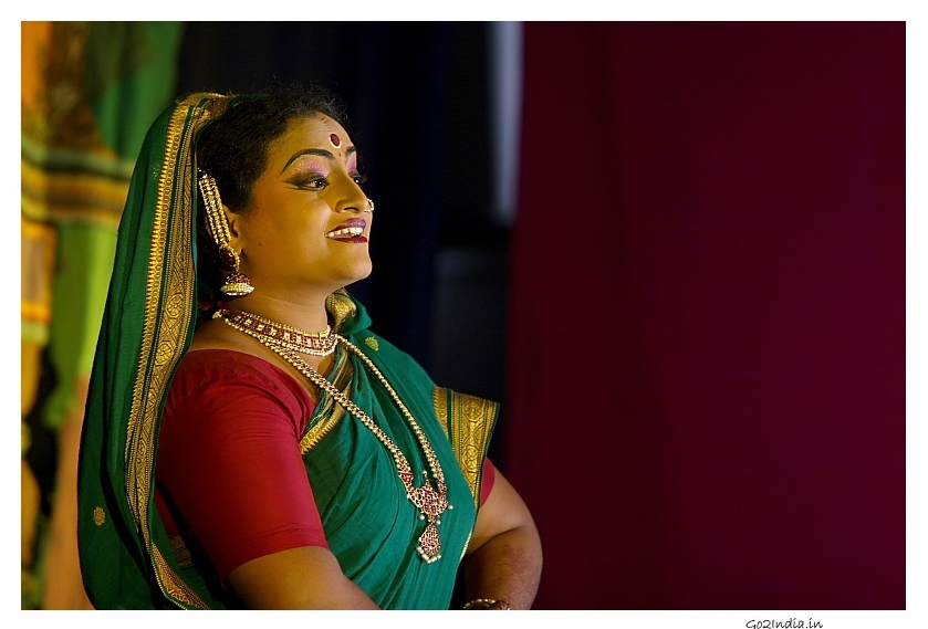 lady  looking curiously in a Kuchipudi performance