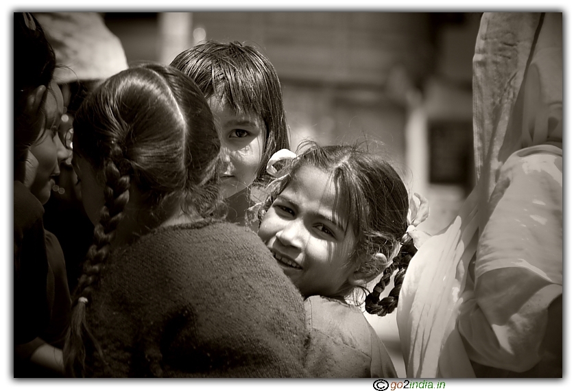 Two girls seeing while photographing near a school at Manikaran