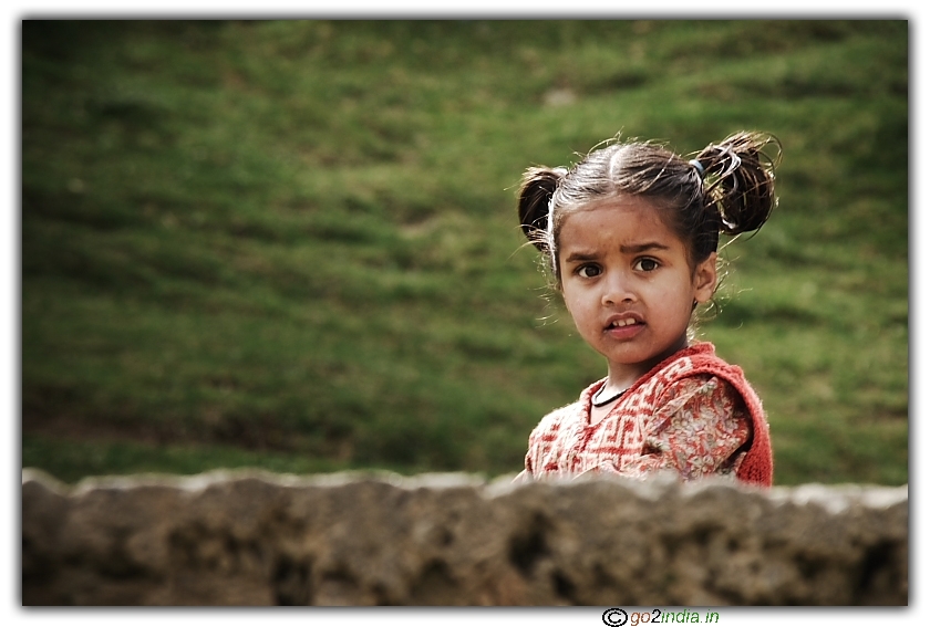 Girl kid looking curiously