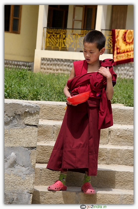Young Lhama at Naggar Monastery going for lunch