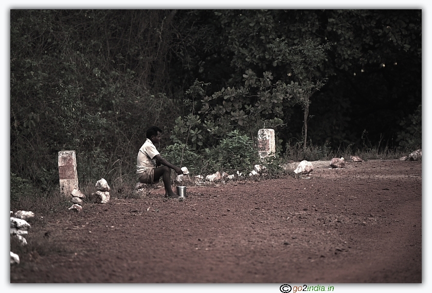 of a person waiting for food to be brought by his family