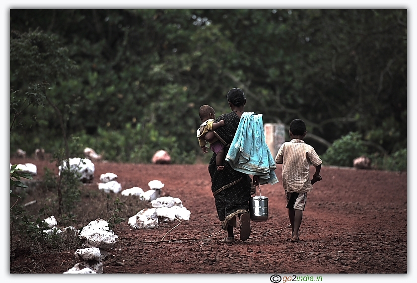 woman carrying food for husband