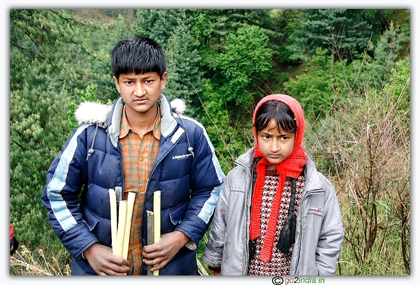 Kids selling sticks during Sarpass trekking