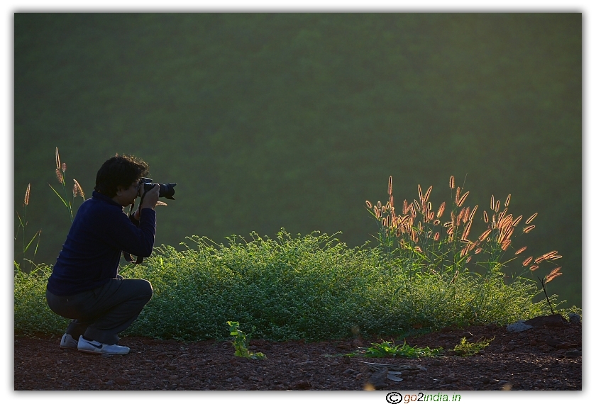 Photographer on action early in morning