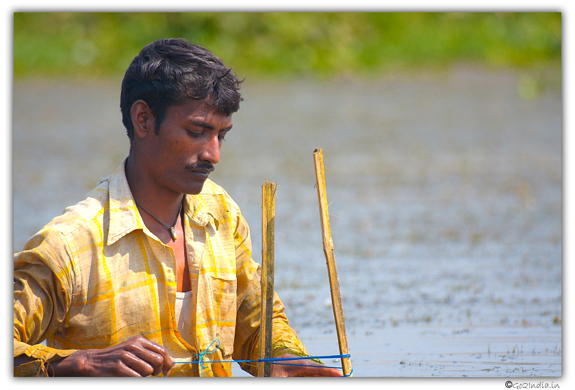 Person putting fence at Oxbow lake 