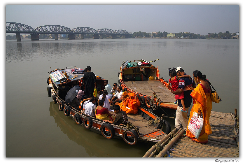 People boarding boat at Dakshineswar to cross Hooghly river to reach Belur