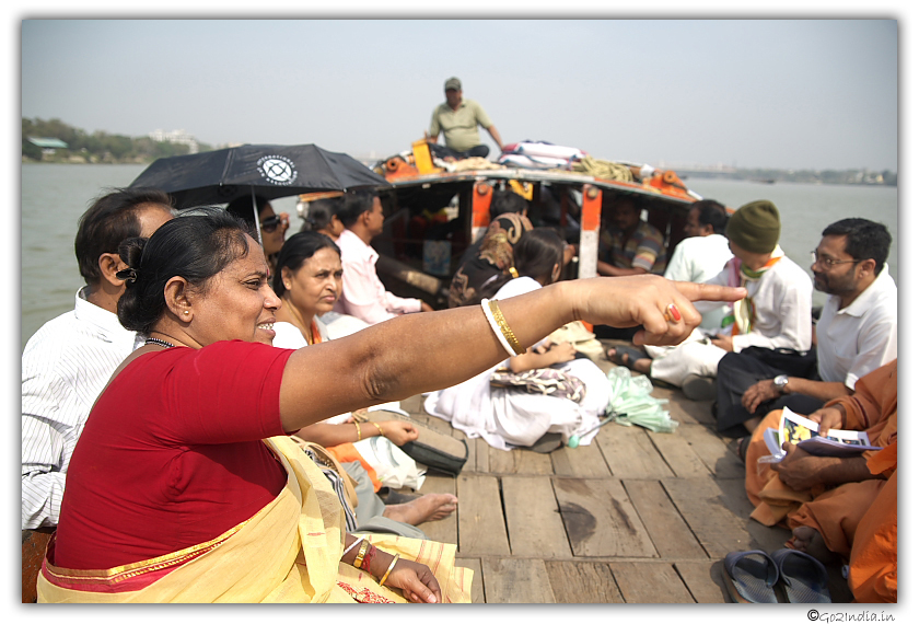 Lady showing something while travelling