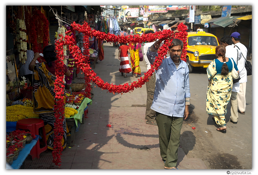 Person showing garland to the visitor