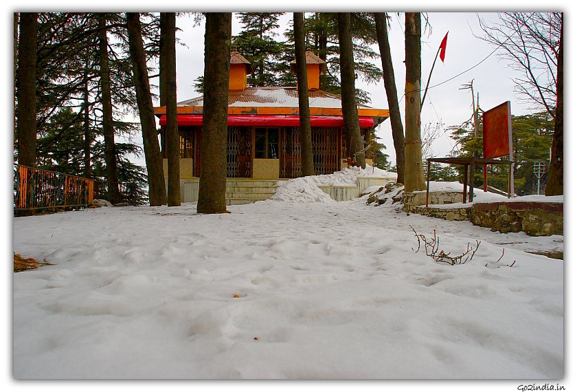 Temple infront of Wild Flower hall in winter at Shimla