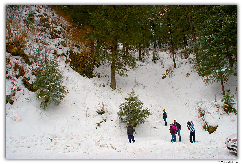 Tourist enjoying snow on the way to Kufri in winter at Shimla