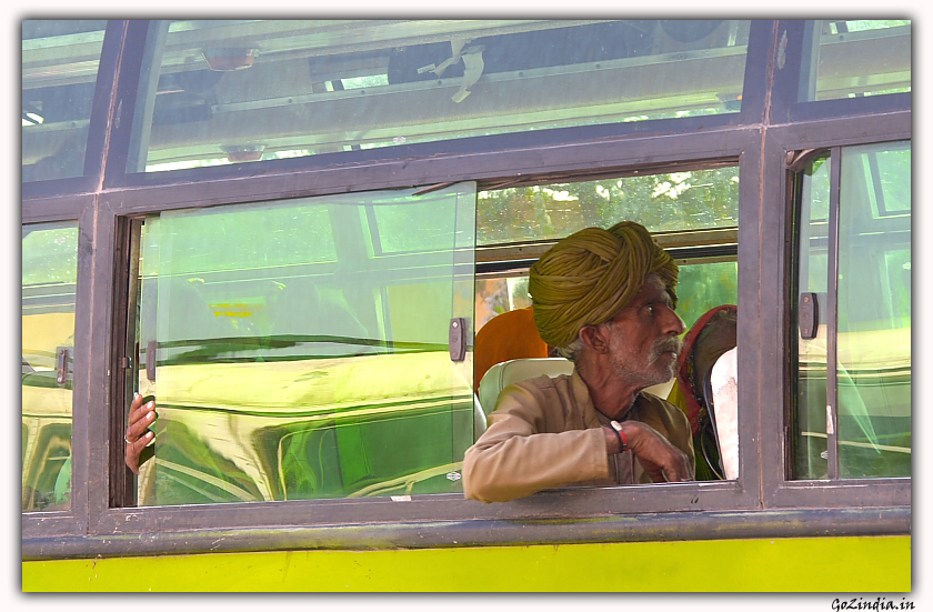 Old man inside a bus in Rajasthan